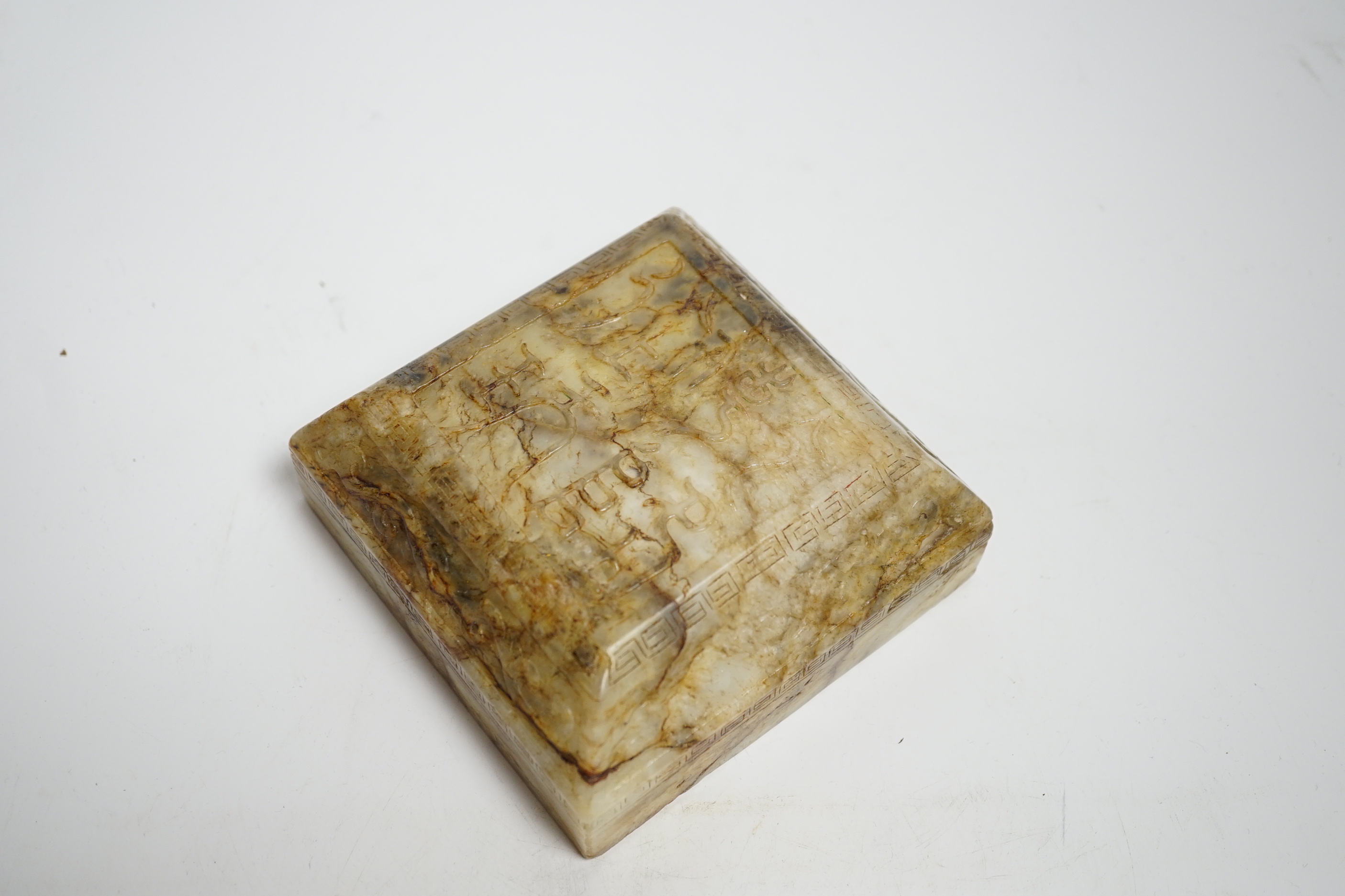 A Chinese bowenite jade scroll weight/seal, 19th/20th century
